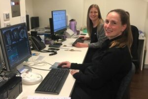 two female doctors looking at scan results